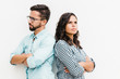 © Mangostar - Annoyed upset couple standing back-to-back with arms crossed. Young woman in casual and man in glasses posing isolated over white background. Conflict in couple concept