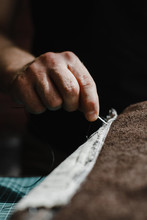 Close Up Of A Leather And Hands Of A Craftsman. Detail Of A Handmade Process