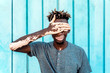 © Santi Nunez/Stocksy - Young man with vitiligo and sky blue background