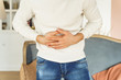 Young man suffering from an abdominal pain