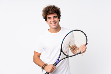 Young caucasian man over isolated white background playing tennis