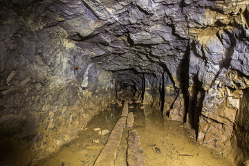 Underground abandoned platinum ore mine tunnel with water