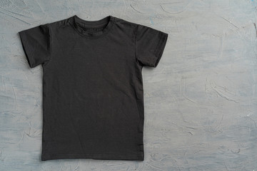 Poster - Black color plain t-shirt with copy space close up