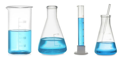 Set of laboratory glassware with blue liquid on white background. Banner design