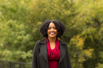 Wall Mural - Beautiful Confident African American Woman Smiling Outside