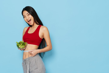 Wall Mural - young woman holding a flower