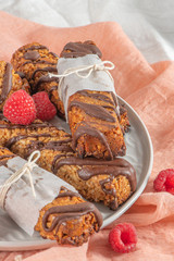 Wall Mural - Cereal bars with raspberries on kitchen counter top.