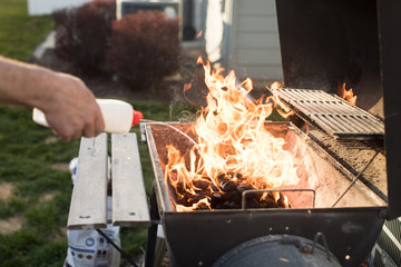 Starting barbecue briquettes with lighter fluid