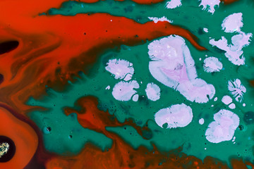 Red, blue and green abstract paint marble background.