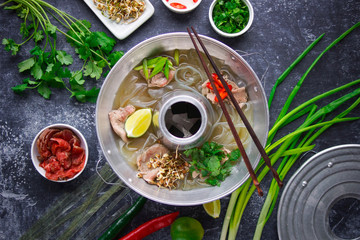 Vietnamese pho bo soup, Asian cuisine, Photo on a dark background