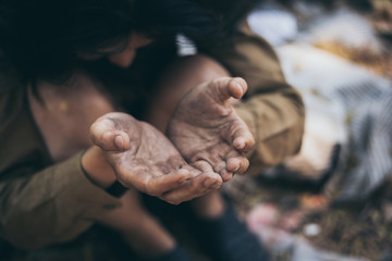 Wall Mural - poor people,homeless or beggar begging for help sitting at dirty slum.concept for poverty hunger,human rights,donate and charity for underprivileged children in third world