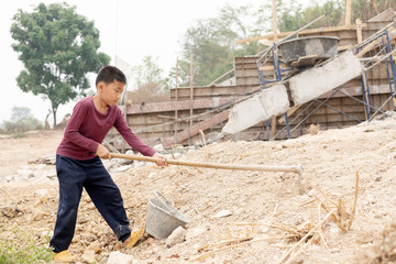 Children working at construction site for world day against child labor concept: