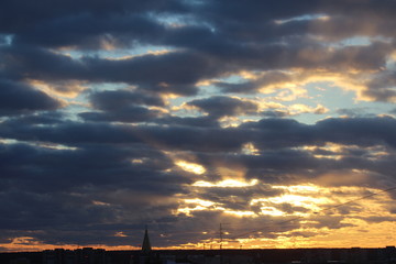 Wall Mural - the suns rays pass through the dark clouds. beautiful dramatic sky at sunset or sunrise.