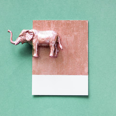 Wall Mural - Colorful elephant figure on a paper