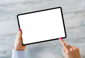 Woman holding tablet with empty white screen