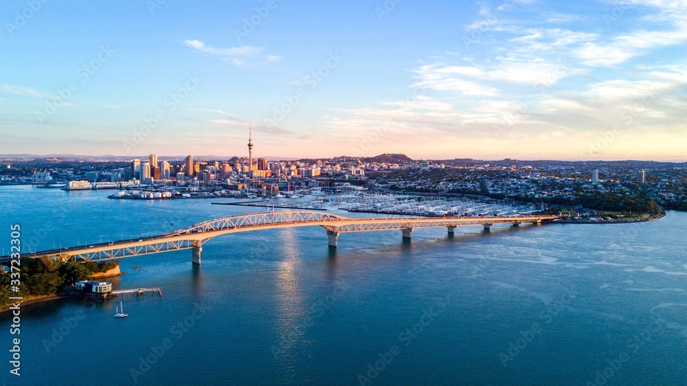 View Of Auckland City At Waterfront Against Cloudy Sky - obrazy, fototapety, plakaty 