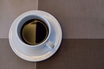 a cup of coffee ready on the table in breakfast time for wake up and refreshing your morning before business working time