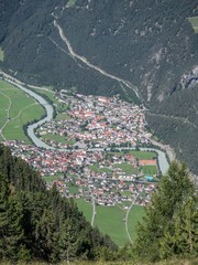 Aerial view of village Pfunds, Upper Inn Valley, Tyrol, Austria, as seen from the summit of peak Frudiger