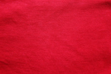 Red Fabric Texture Background, Empty Cotton Red Cloth Wallpaper. Soft Textile Material, Close Up Top View Of Simple Wavy T-shirt Structure, Fashion Clothes Plain Unprinted Design
