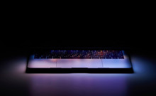 Laptop With Touchbar On Dark Background, Color Light
