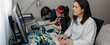 © David Pereiras - Woman teleworking with her children doing homework. Selective focus on woman in foreground