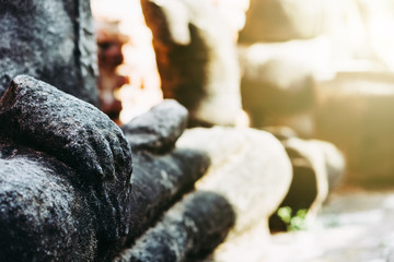 Wall Mural - Blurred Background antique buddha pagoda statue in Thailand Ayutthaya buddhist ancient temple. Thai tourist pray for good luck, zen peaceful and holy meditation relax.