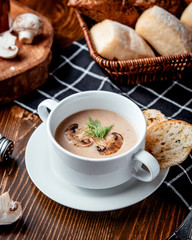 Canvas Print - mushroom soup with bread on the table