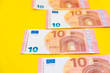 © Andriy - Euro banknotes on a yellow background. Copy, empty space for text