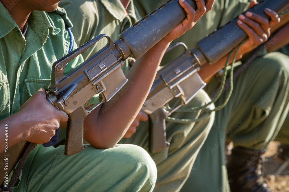 closeup of anti poaching unit holding rifles Stock Photo | Adobe Stock