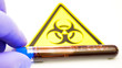 The yellow hazard sign with the blood sample kit