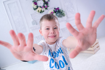 Teen boy laughs light background