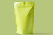 close up of matt green paper doypack stand up packaging pouch with zipper on light green background