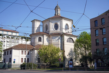  Italy , Milan - Basilic of Santo Stefano catholic church  in Downtown of the city empty of people during n-cov19 Coronavirus outbreak epidemic quarantine home, closed religious ceremony