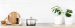 White modern kitchen interior with wooden worktop and kitchenware, culinary concept, background, banner