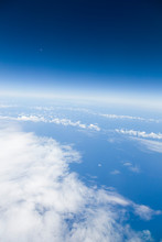 Clear Blue Sky, Moon, Atlantic Ocean And Clouds View From An Air