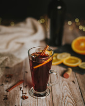Mulled Wine And Its Ingredients On A Wooden Table