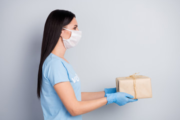 Canvas Print - Close-up profile side view portrait of her she nice attractive girl voluntary social worker giving paper box charity donation help purchase isolated over grey pastel color background