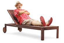 Elderly Man Lying On A Wooden Sunbed