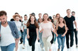 © ASDF - group of diverse young people hurrying towards their goal