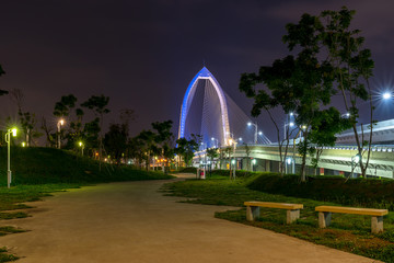 Wall Mural - Nightscape of new landmark Konan Ai-Qin Bridge in Taichung City, Taichung Central Park at the Xitun District Shuinan Economic and Trade Area. The second largest park in Taiwan