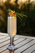 Refreshing spirit beverage perfect for outdoor event. Fancy beverage decoration with crafted leaf, lemon sliced and orange zest. Garden view beverage photography. Pool side area in hotel.