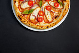 Fototapeta  - pizza with cheese and chicken with tomatoes