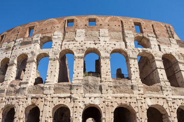 Fragment of arches of Colosseum or Coliseum (Flavian Amphitheatre or Amphitheatrum Flavium or Anfiteatro Flavio or Colosseo. Oval amphitheatre in the centre of the city of Rome, Italy