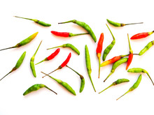 Wallpaper With Fresh Green And Red Hot Chili Peppers Isolated On White Background.