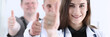 © H_Ko - Group of doctor show OK or approval sign with thumb up portrait. High level service, best treatment, 911, healthy lifestyle, satisfied patient, therapeutist consultation, physical concept