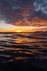 Wall Mural - view of stormy clouds over sea during sunset