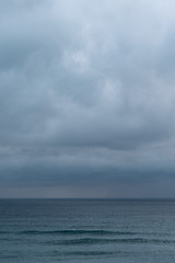 Wall Mural - view of sea against cloudy sky during rain