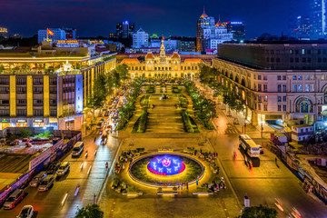 Aerial panoramic cityscape view of HoChiMinh City People's Committee and Nguyen Hue Walking Street , Vietnam with blue sky at sunset. 