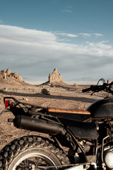 Wall Mural - motorcycle parked on desert landscape in monument valley