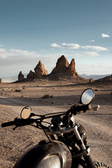 Wall Mural - motorcycle parked on desert landscape in monument valley